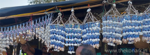 Vendor selling handicraft items made out of shells and oysters